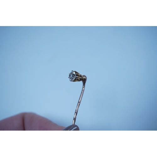 1939 - A yellow metal and solitaire diamond set stick pin, the stone diameter approx. 5mm, 59mm, gross weig... 