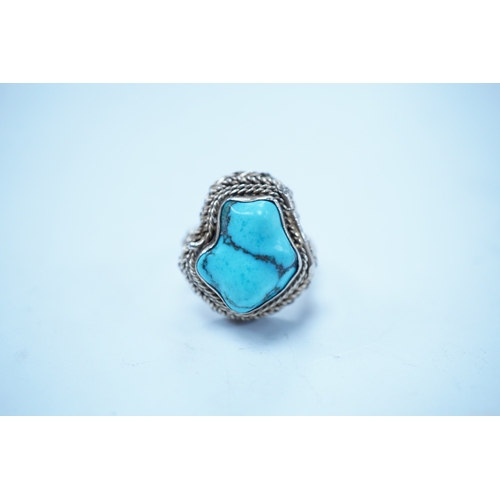 1948 - A Chinese gilt white metal and turquoise set 'poison ring' the hinged compartment opening to reveal ... 