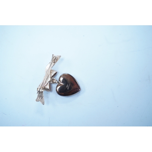 1955 - A modern engraved 9ct gold heart shaped locket, on an associated 9ct gold ribbon bow suspension broo... 