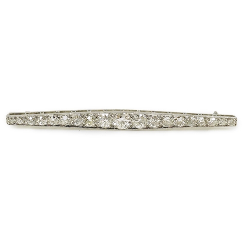 1967 - A 1920's platinum? and nineteen millegrain set graduated diamond bar brooch, 59mm, gross weight 4.6 ... 