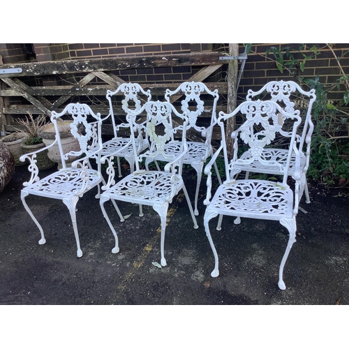 103 - A white painted cast aluminium garden table, width 183cm, depth 92cm, height 71cm, and six chairs. C... 