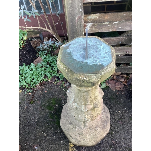 107 - A reconstituted stone sundial, with bronze dial and gnomon, height 86cm. Condition - fair