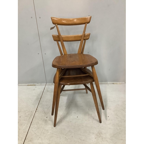 21 - A pair of mid century Ercol elm and beech stacking chairs, width 39cm, depth 35cm, height 76cm. Cond... 