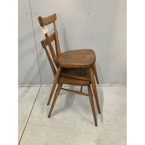 21 - A pair of mid century Ercol elm and beech stacking chairs, width 39cm, depth 35cm, height 76cm. Cond... 