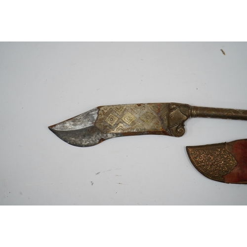 256 - An Indian axe bhuj, with broad curved blade, iron haft with elephant head top, all covered over with... 