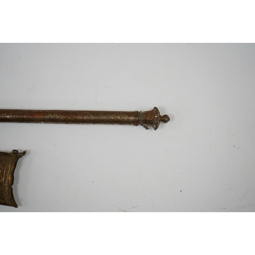 256 - An Indian axe bhuj, with broad curved blade, iron haft with elephant head top, all covered over with... 