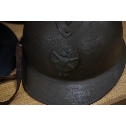 257 - Seven early to mid 20th century military tin helmets; including one stencilled with POLICE. Conditio... 