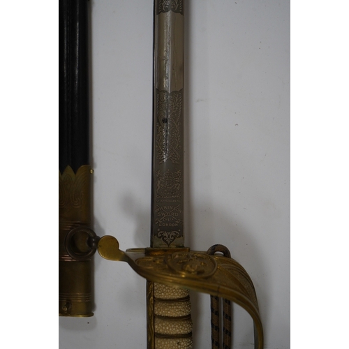 259 - A George VI naval officers dress sword by Wilkinson (unnumbered), with regulation brass hilt with f... 