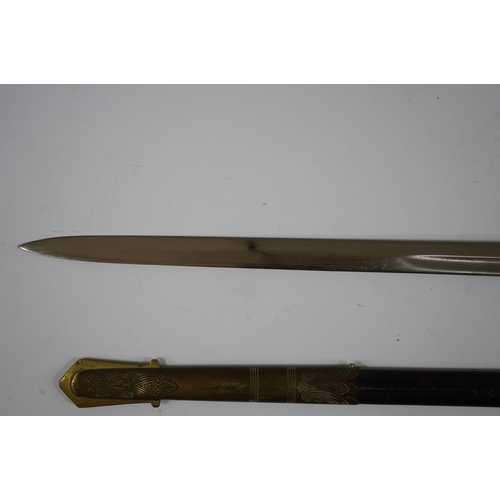 259 - A George VI naval officers dress sword by Wilkinson (unnumbered), with regulation brass hilt with f... 