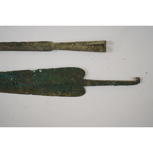 264 - Two assorted Bronze Age spearheads, one of leaf shape with turned over tang, the other short with na... 