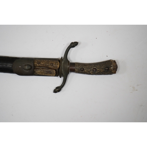 266 - A 19th century Continental hunting hanger, blade cut with twin fullers, recurved brass crosspiece wi... 