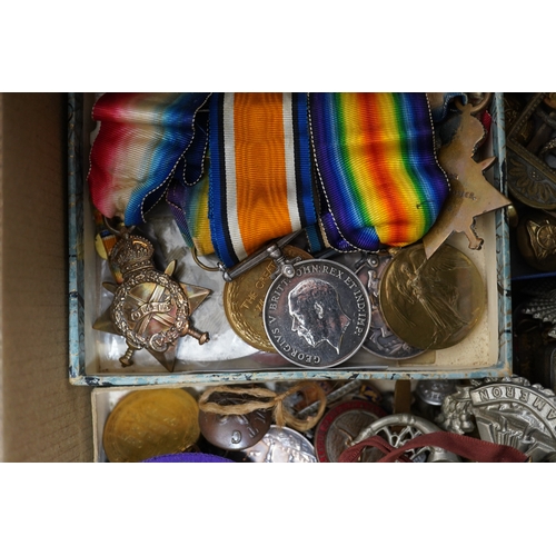 276 - A collection of military medals, cap badges and buttons etc. including; a First World War Royal Navy... 