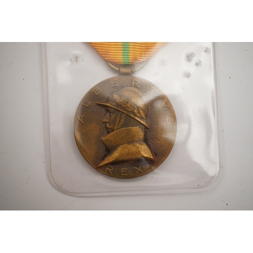 283 - A collection of medal related items, etc., including; a Belgium Albert I commemorative medal,a cased... 