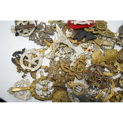 287 - Sixty military cap badges, including; the Brecknockshire Regiment, the Royal Warwickshire Regiment, ... 