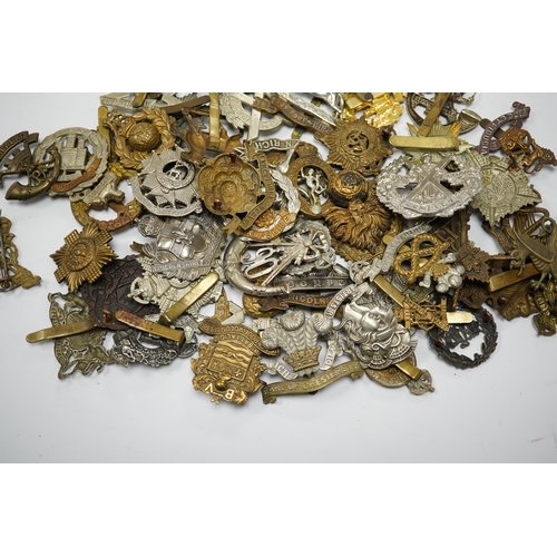 288 - Sixty military cap badges including; the Lancashire Hussars, the Royal Corps of Signals, the Essex R... 