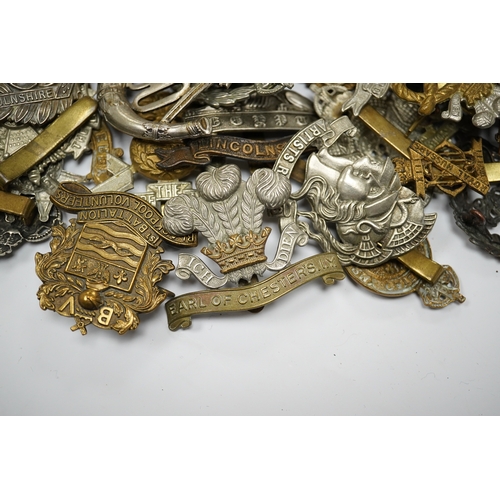 288 - Sixty military cap badges including; the Lancashire Hussars, the Royal Corps of Signals, the Essex R... 