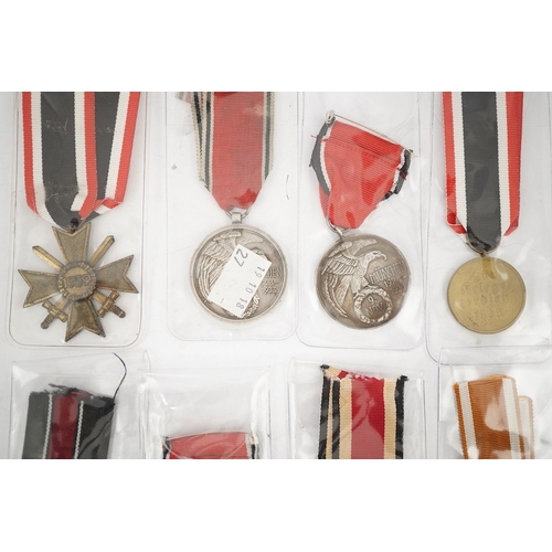 294 - Nine German WWII medals; three Blood Order medals, a Second class Iron Cross, a War Merit medal in i... 