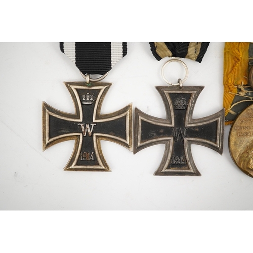 297 - Five German WWI medals; two Second class Iron Crosses, two Kaiser Wilhelm Centenary medals and an Ho... 