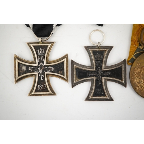 297 - Five German WWI medals; two Second class Iron Crosses, two Kaiser Wilhelm Centenary medals and an Ho... 