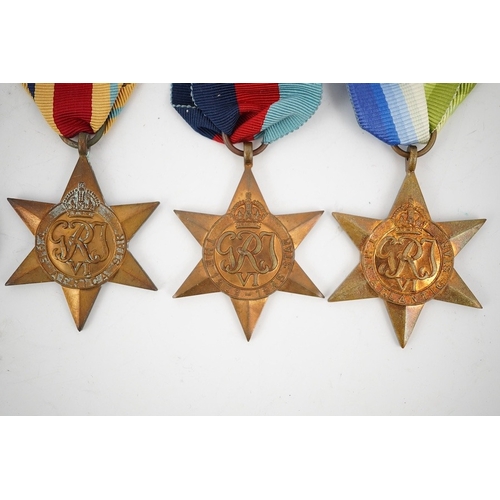 298 - Seven WWII medals and stars; The Burma Star with a clasp for Pacific,The Africa Star with a clasp fo... 