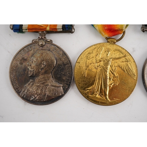 299 - A First World War medal trio and Naval Reserve Long Service medal awarded to R.E.A. Lawrence ENGN RN... 