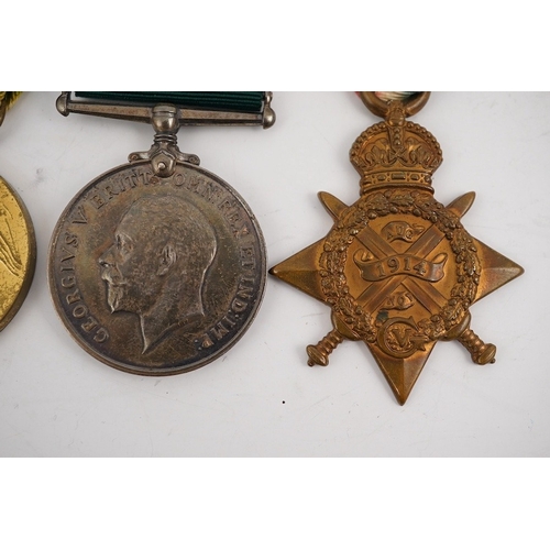 299 - A First World War medal trio and Naval Reserve Long Service medal awarded to R.E.A. Lawrence ENGN RN... 