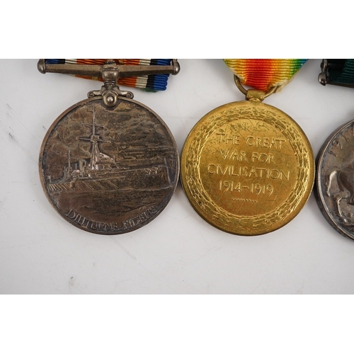 299 - A First World War medal trio and Naval Reserve Long Service medal awarded to R.E.A. Lawrence ENGN RN... 