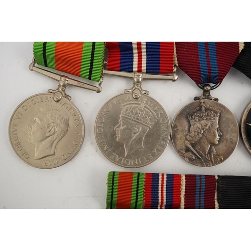 301 - A WWII and later medal group of five medals, together with its miniature set, comprising; The Defenc... 