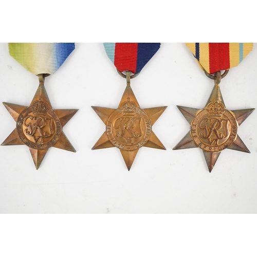 303 - Seven WWII medals and stars; The Africa star, with a clasp for 1st Army,The Atlantic star, with a cl... 