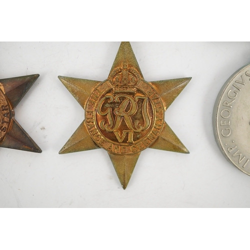 303 - Seven WWII medals and stars; The Africa star, with a clasp for 1st Army,The Atlantic star, with a cl... 