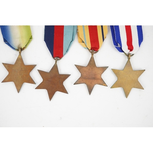 303 - Seven WWII medals and stars; The Africa star, with a clasp for 1st Army,The Atlantic star, with a cl... 