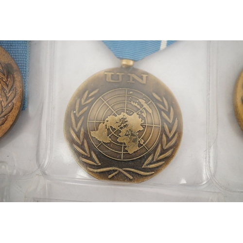 307 - Fourteen United Nations (UN) medals, all with in the service of peace to the reverse, including a ... 