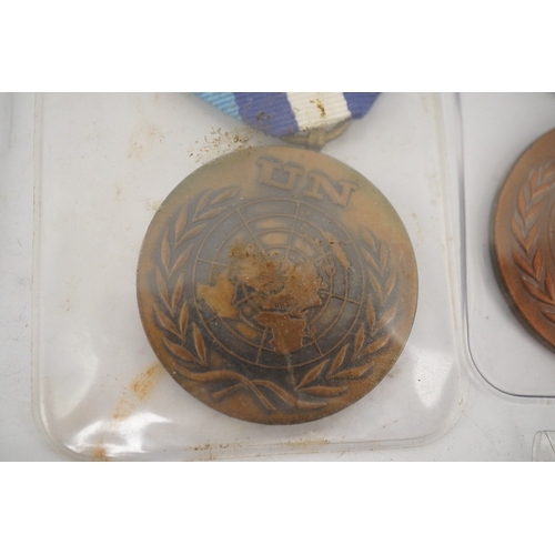 307 - Fourteen United Nations (UN) medals, all with in the service of peace to the reverse, including a ... 