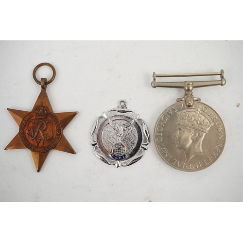 314 - A WWII Defence medal and The France and Germany Star together with a cased Royal Navy Reserve Decora... 