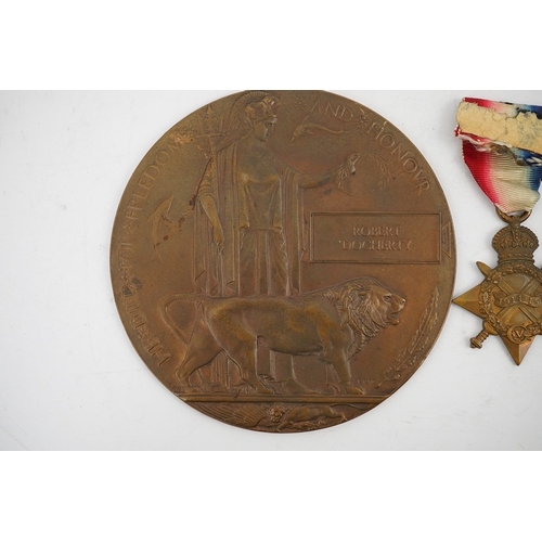 315 - A First World War medal trio and commemorative plaque awarded to PTE. R. Docherty S. GDS. Condition ... 