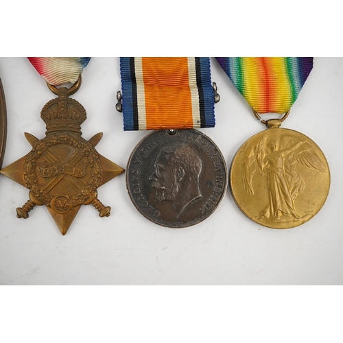 315 - A First World War medal trio and commemorative plaque awarded to PTE. R. Docherty S. GDS. Condition ... 