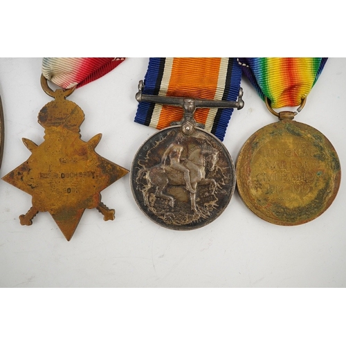 315 - A First World War medal trio and commemorative plaque awarded to PTE. R. Docherty S. GDS. Condition ... 