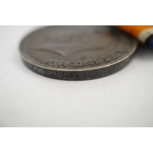 315 - A First World War medal trio and commemorative plaque awarded to PTE. R. Docherty S. GDS. Condition ... 