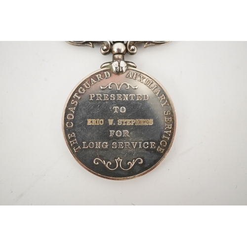 320 - A cased ERII The Coastguard Auxiliary Service Long Service medal, awarded to Eric W. Stephens. Condi... 