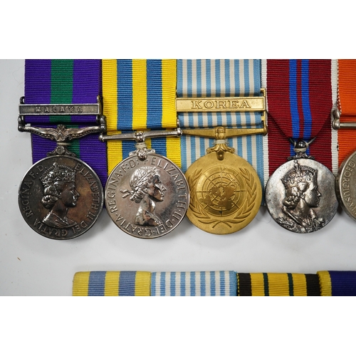 330 - Twelve ERII and George VI medals, some medals arranged into two medals groups (containing unnamed me... 