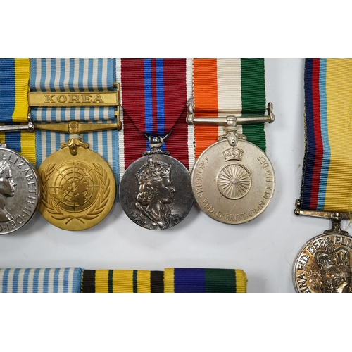 330 - Twelve ERII and George VI medals, some medals arranged into two medals groups (containing unnamed me... 