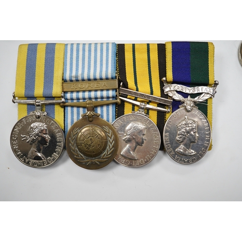 330 - Twelve ERII and George VI medals, some medals arranged into two medals groups (containing unnamed me... 