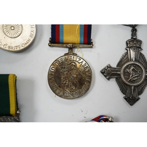 330 - Twelve ERII and George VI medals, some medals arranged into two medals groups (containing unnamed me... 