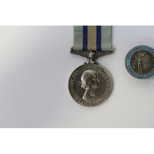 342 - An ERII (B) Royal Observer Corps medal to Observer W.Cook with a lapel badge. Condition - fair.... 