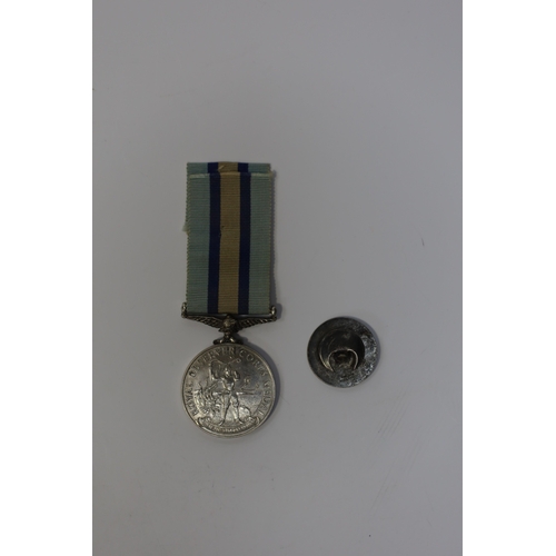 342 - An ERII (B) Royal Observer Corps medal to Observer W.Cook with a lapel badge. Condition - fair.... 