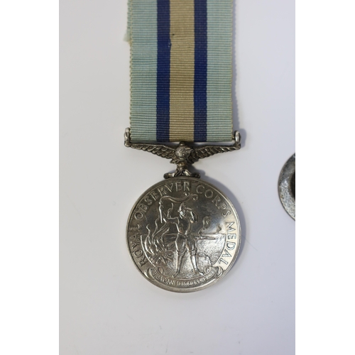 342 - An ERII (B) Royal Observer Corps medal to Observer W.Cook with a lapel badge. Condition - fair.... 