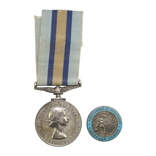 342 - An ERII (B) Royal Observer Corps medal to Observer W.Cook with a lapel badge. Condition - fair.... 