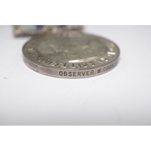 342 - An ERII (B) Royal Observer Corps medal to Observer W.Cook with a lapel badge. Condition - fair.... 