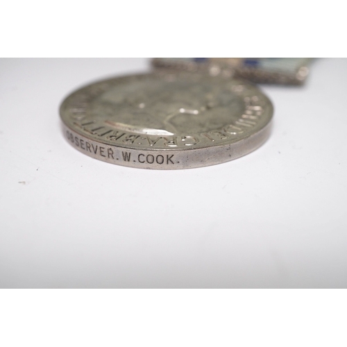 342 - An ERII (B) Royal Observer Corps medal to Observer W.Cook with a lapel badge. Condition - fair.... 