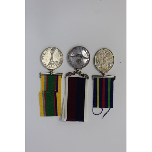 343 - Three assorted service medals; GVI Cadet Forces medal to ACT. FG. Off. A. Liddell R.A.F.V.R (T); ERI... 